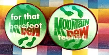 2- RARE 1970s VARI-VUE MOUNTAIN DEW FOR THAT BAREFOOT FEELING FLICKER PIN 3" NOS