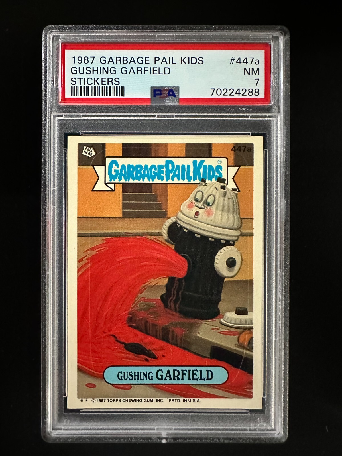 1987 Garbage Pail Kids #447a STICKERS - Gushing Garfield - PSA 7 view 1