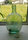 NICE PUMPKINSEED FLASK EMBOSSED, G. ISMAY WINE & SPIRIT MERCHANT CARLISLE