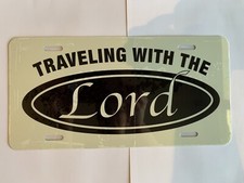 Made in the USA! Traveling With The Lord license plate.
