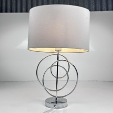 Beautiful modern contemporary large table lamp featuring interlocking ring base