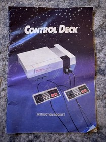 Nintendo NES with 12 games, 2 controllers, game pad, & zapper. Great condition!!