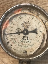 vintage pressure gauge, also known as a barometric altimeter