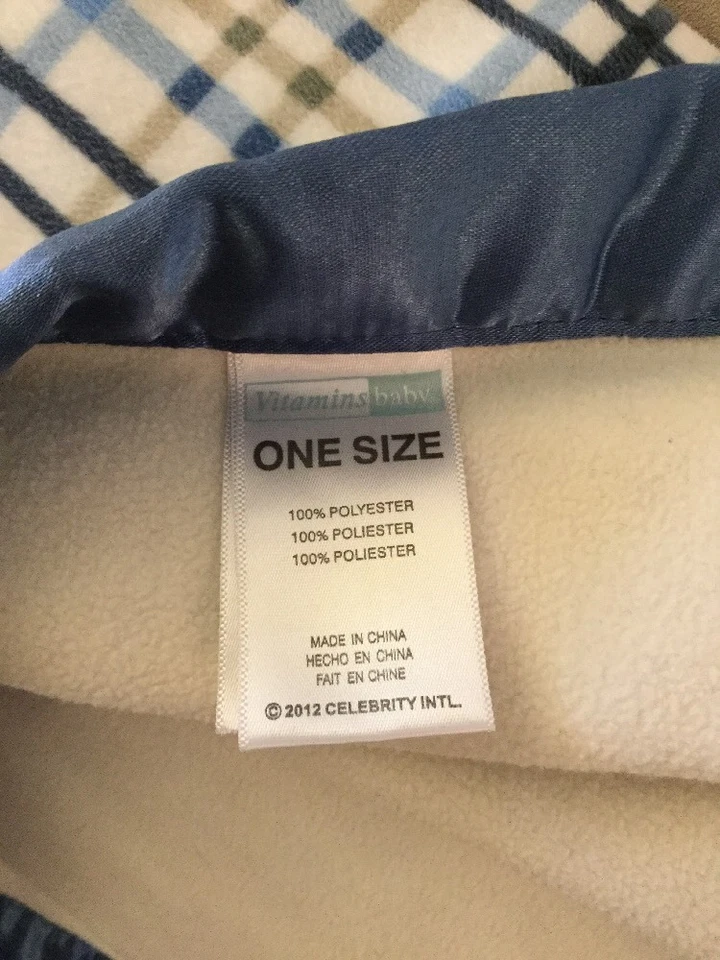 Manta de bebé Vitamin Baby azul marrón a cuadros polar satinado con bordes Foto 3 de 4