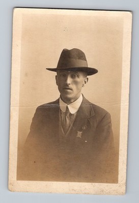 Young Man Sits for Portrait Serious Expression w/ Hat & Wool Suit RPPC Postcard
