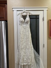 Galina Signature based The lace, beading, and champagne undertonesbridal styles.