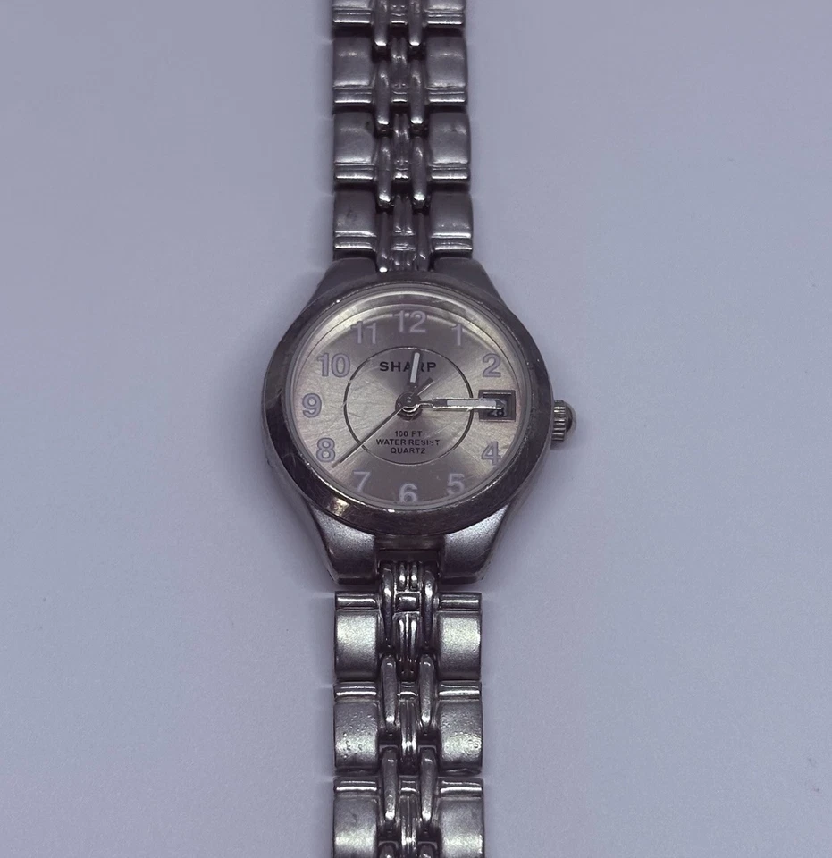 Reloj para mujer Sharp SHP5304 vintage 23 mm tono plata fecha 7,25” esfera rosa 31 Foto 2 de 4
