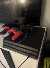 playstation 4 console used with 2 controllers