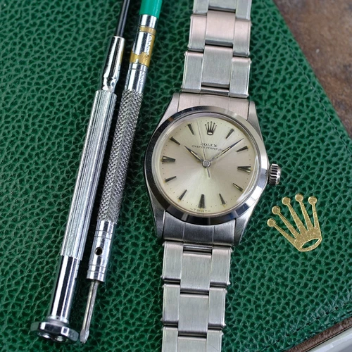 Rolex Oyster Perpetual 6548 Silver Dial 31mm Steel Smooth Bezel Oyster Band