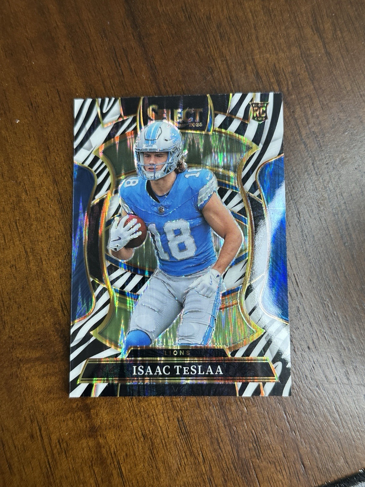 2025 Panini Select - Concourse Isaac Teslaa Zebra Shock Prizm (RC) SSP Lions