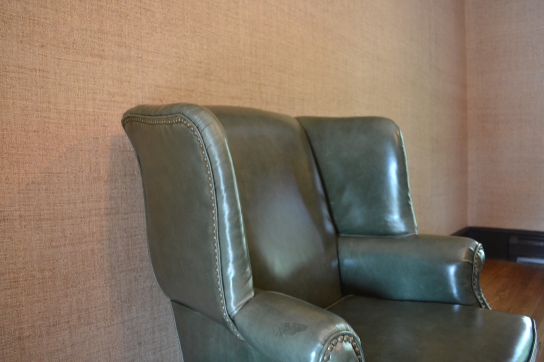 Late 20th Century Leather Chippendale Wing Chair and Ottoman