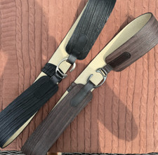 Two-pack of wide belts in neutral tones one in textured black and one in deep