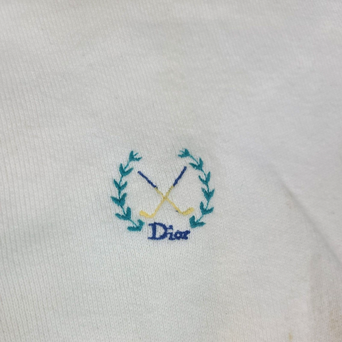White VTG Christian Dior men’s V-neck sweater with blue monogram and gold-white cross golf logo on chest.