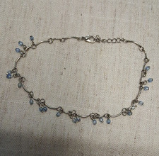 Cavigliera catena cavo regolabile tono argento con perline blu pendenti aragosta