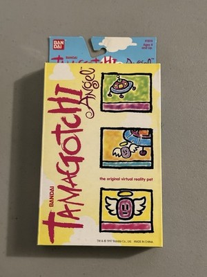 Vintage 1997 Bandai Tamagotchi Virtual Pet ANGEL Silver Pearl New Open Box
