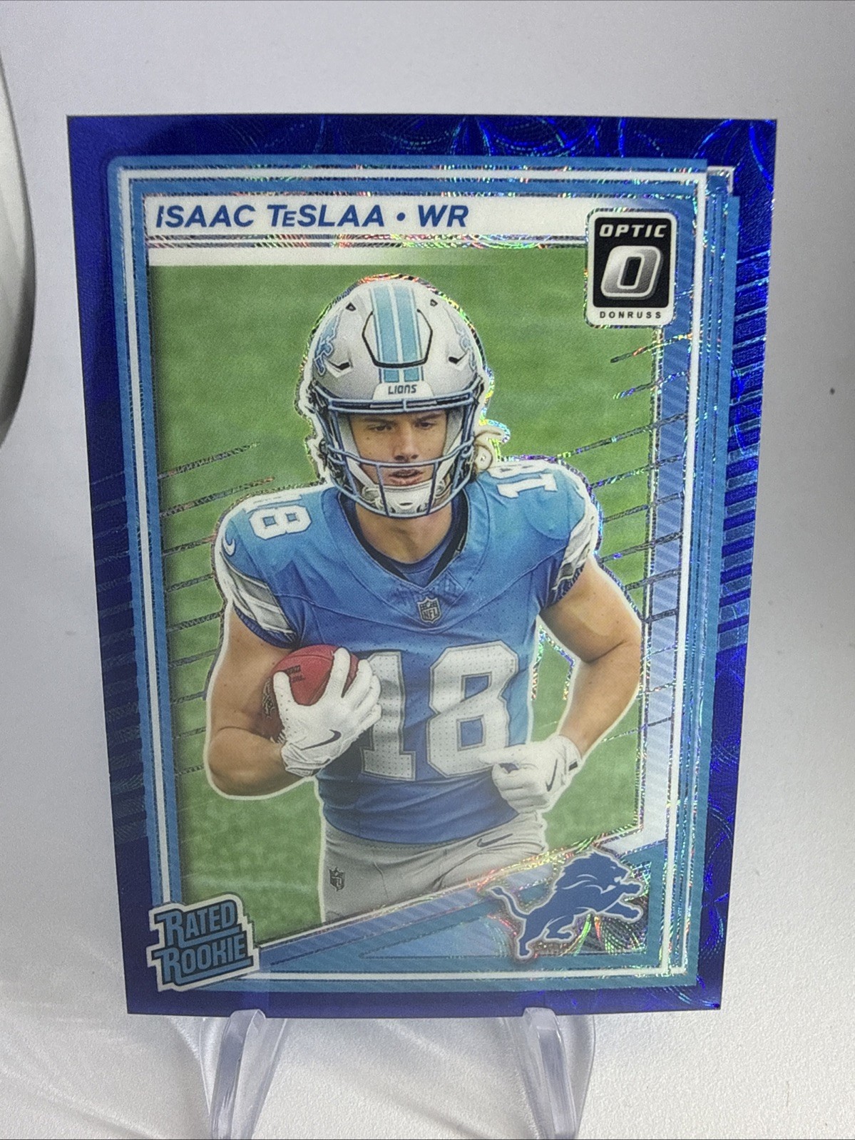 2025 Optic Isaac TesLAA (RC) Blue Scope Prizm #219 Detroit Lions!