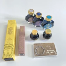 Lot of Ferris Wheet Press items: 2 fountain pens, 5 inks