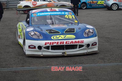 PHOTO  COLIN SMITH RETURNS TO PARC FERME IN HIS GINETTA G40 AFTER THE FIRST CMMC