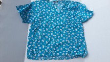 Michael blue scrubs top with daisy print size XL