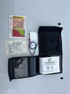 Two (2) National Association Scuba Dive School Log Books with dive chart tables.