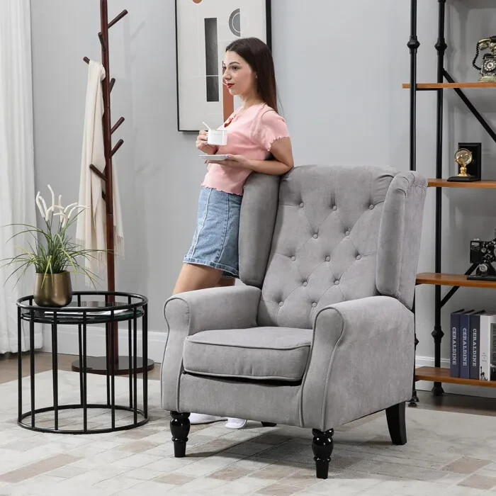 Fauteuil de salon haut de gamme capitonné avec piètement chêne