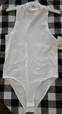 A New Day White Sleeveless body suit. Size Med. A Summer Essential. New W/Tags