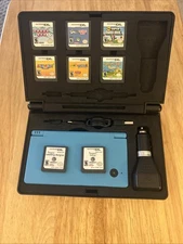Nintendo DSi Light Blue Handheld System Bundle w/Games And Case Near Mint