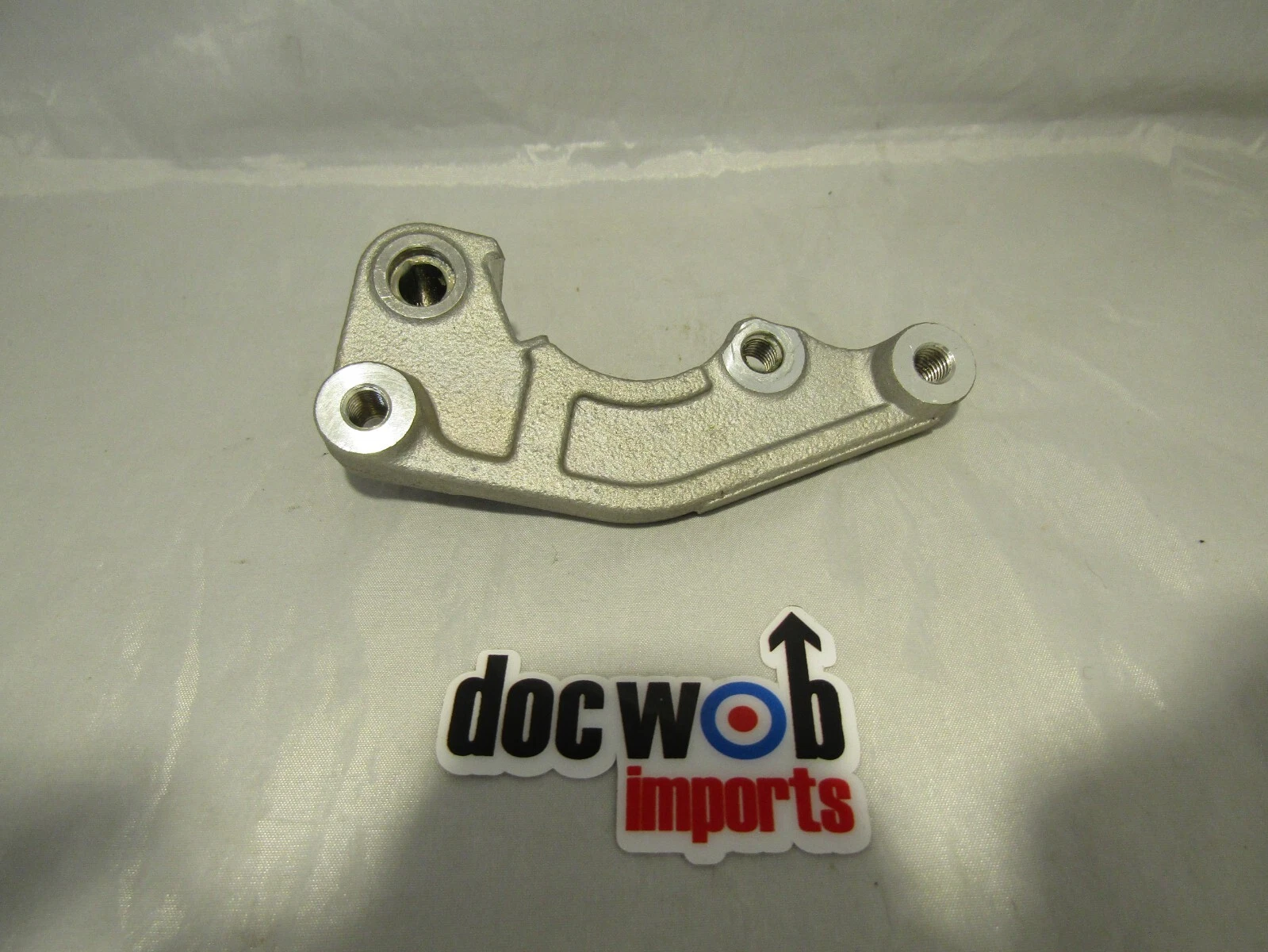 KAWASAKI KXF 250/450 2021-2024   NEW OEM FRONT BRAKE CARRIER   KX3855