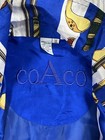 Blue silk COACO women’s XL windbreaker with yellow tennis player print and navy “COACO” logo on back.