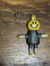 SMOKEBUDDY Keychain Green Plastic Smoke Buddy Poseable Happy Smiley Face