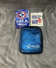 Two instant cold packs with blue first aid bag