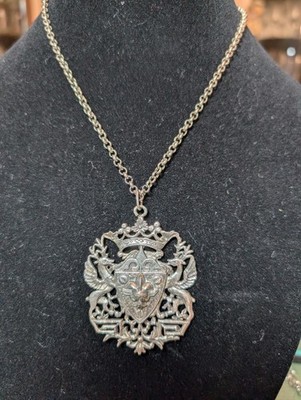 Vintage crest Necklace With A Large Ornate Shield, Crown And Winged Deer