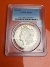 1884 - O  morgan silver dollar 90 % silver PCGS - MS64