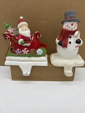 2 Vintage Cast Iron Stocking Hanger Holders Snowman  Santa Claus Christmas