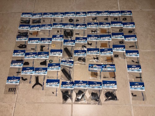 X-Ray XB4 & XB2 Buggy HUGE Parts Lot. NEW ! Over 50 Parts In package. Save $$$