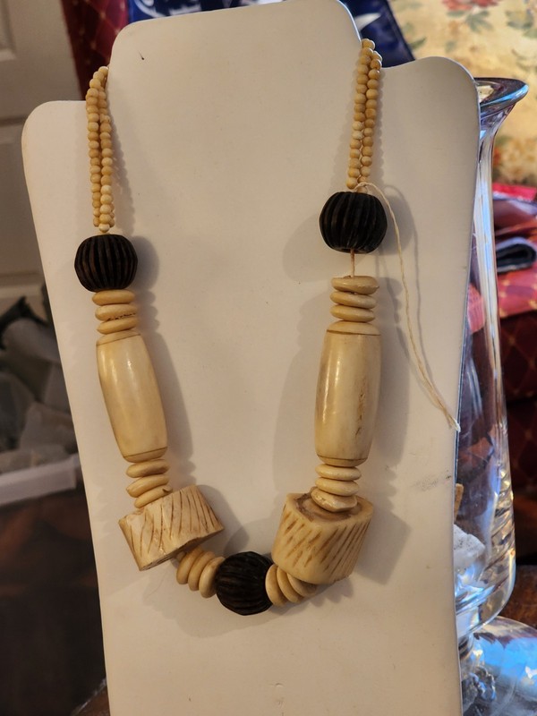 J298.  22" African Carved Bovine and Wood Bead Necklace