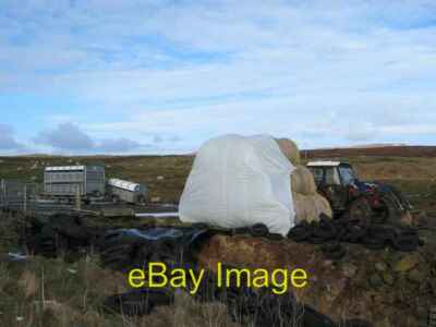 Photo 6x4 Ose Farm A recently dug pit and assorted farming equipment on c2006