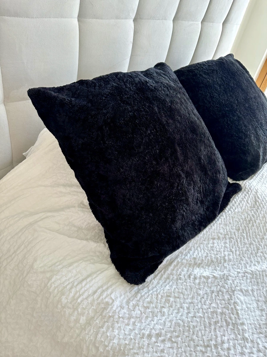 Black faux fur cushion covers top