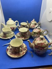 4  Miniature tea cup and pitcher sets, Pink Rose themed.Cup,Saucer,Pitcher