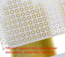 50 brass shim washers. 1/8th inner dia (minimum) for 1/8th axles. 0.5mm thick