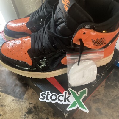 Size 10 black n orange Jordan high top 1s 