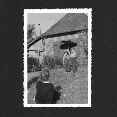 Children umbrella garden sun - vintage photo snapshot 1953