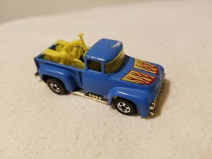 hot wheels 1973 blue truck with motorcycles