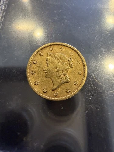 1854 Gold Dollar — photo from the most recent tracked eBay sale