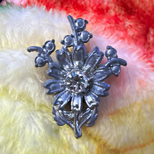 vintage pot metal brooch features a floral sp...