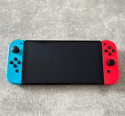 Nintendo Switch OLED Konsole mit Neon Rot/Blau Joy-Con, 64 GB Speicher,