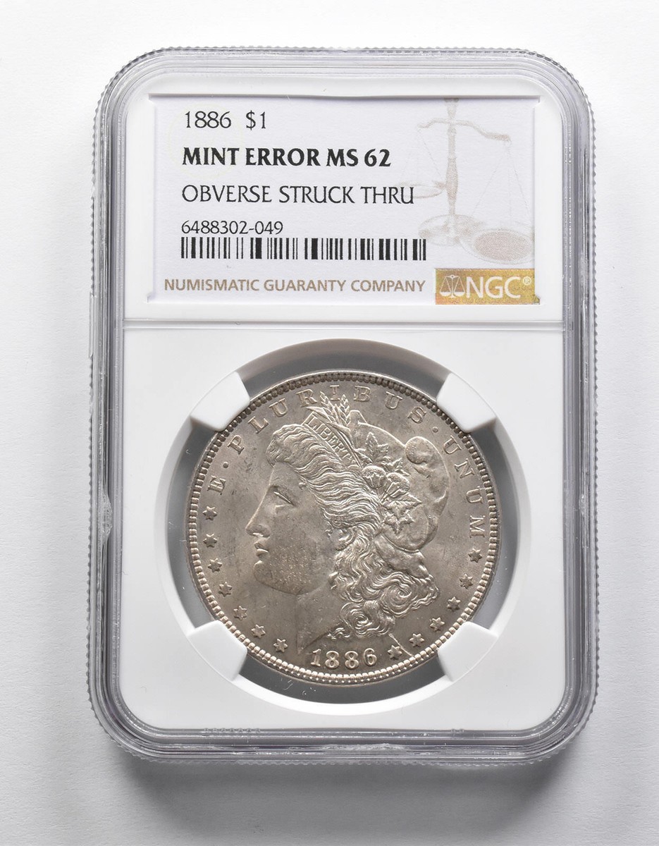 Mint Error MS62 1886 Morgan Silver Dollar OBV Struck Thru NGC