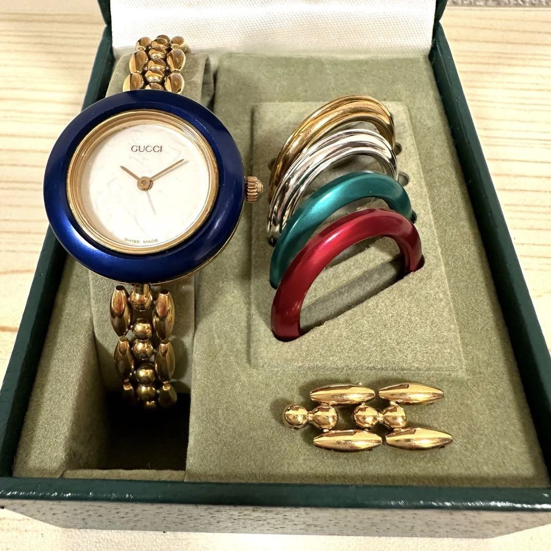 Montre GUCCI 11/12.2 lunette à changement montre bracelet vintage dorée