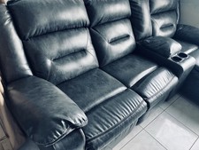 Power Reclining Sectional Sofa with Cup Holders and Console by Ashley Furniture