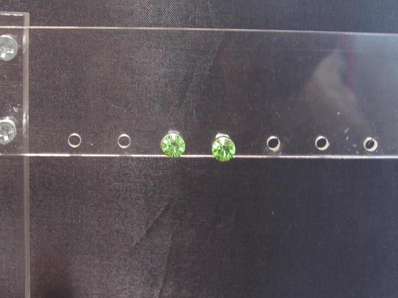 Stud Earrings Silver Tone with a Green Rhinestone-image